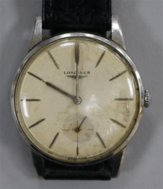 A gentlemans steel Longines manual wind wrist watch.